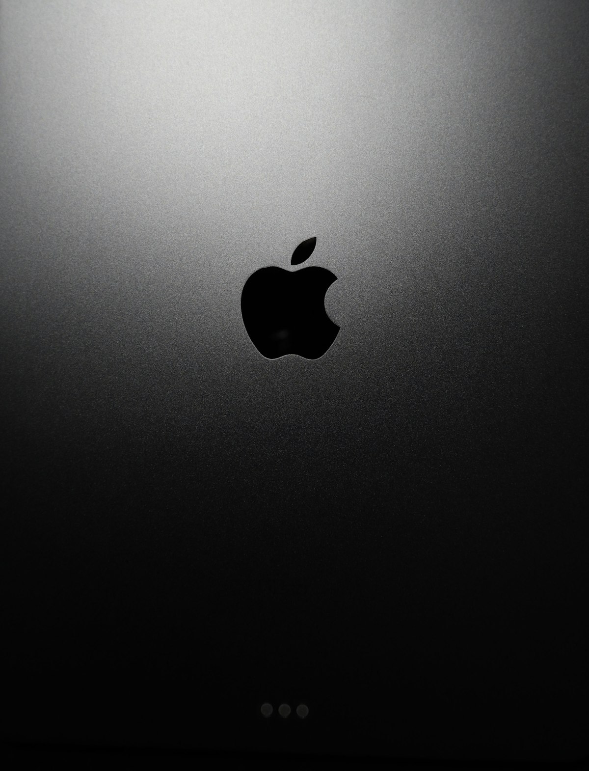 Apple M5 processor chip architecture with dual-die system on black background