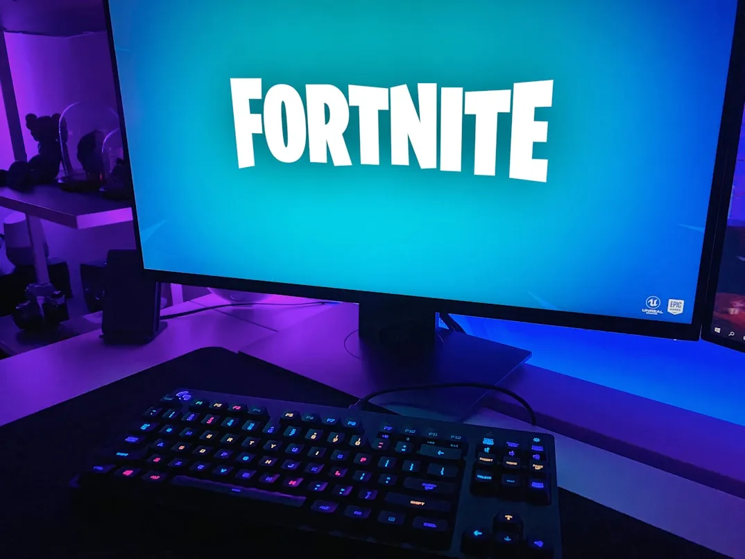 Black flat screen computer monitor and keyboard on desk