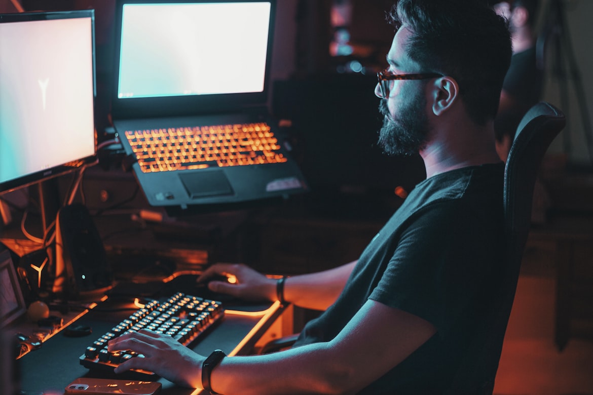 Developer at computer symbolizing tech industry and gaming workforce challenges